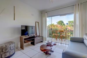 Uma TV ou centro de entretenimento em Pousada Residenzial Cariocare