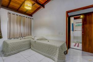 Cama ou camas em um quarto em Pousada Residenzial Cariocare