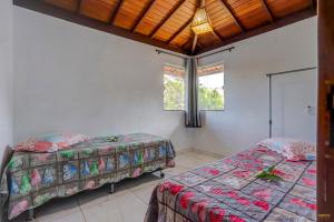 Cama ou camas em um quarto em Pousada Residenzial Cariocare