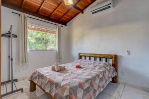 Cama ou camas em um quarto em Pousada Residenzial Cariocare