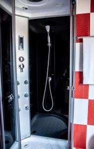 a shower in the back of a vehicle at Casa Robi in Peştişani