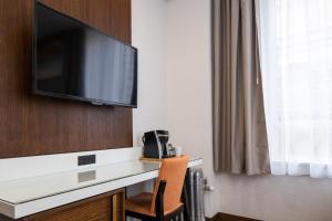 
A television and/or entertainment center at Hotel 32One
