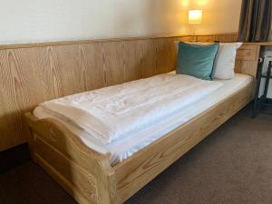Postel nebo postele na pokoji v ubytování Hotel in den Herrnwiesen