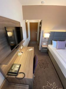 Postel nebo postele na pokoji v ubytování Hotel in den Herrnwiesen