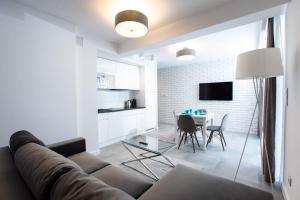 TV a/nebo společenská místnost v ubytování Resort Apartamenty Klifowa Rewal 30