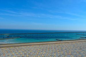 a view of the ocean from a walk way at Chayka Resort in Odesa