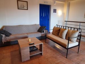 A seating area at Stoupa Lefktro 9