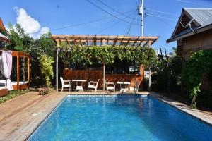 Swimmingpoolen hos eller tæt på Descanso En Paraiso Resort