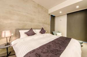 Giường trong phòng chung tại 礁溪320山館 Jiaoxi Shanguan B&B
