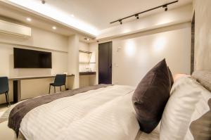 Giường trong phòng chung tại 礁溪320山館 Jiaoxi Shanguan B&B