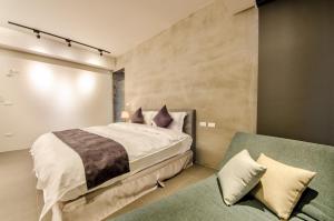 Giường trong phòng chung tại 礁溪320山館 Jiaoxi Shanguan B&B
