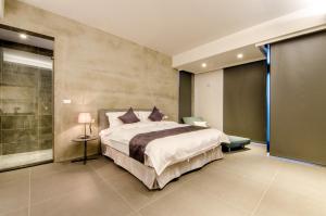 Giường trong phòng chung tại 礁溪320山館 Jiaoxi Shanguan B&B