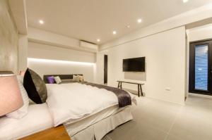 Giường trong phòng chung tại 礁溪320山館 Jiaoxi Shanguan B&B