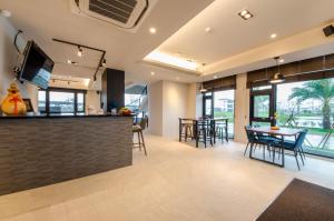 a kitchen and dining room with a table and chairs at 礁溪320山館 Jiaoxi Shanguan B&B in Jiaoxi
