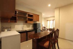 Eldhús eða eldhúskrókur á Mutiara Suites