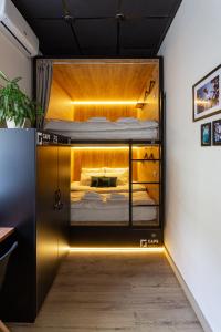 a room with a bunk bed with lights on it at Капсульный отель CAPS Hotel in Moscow