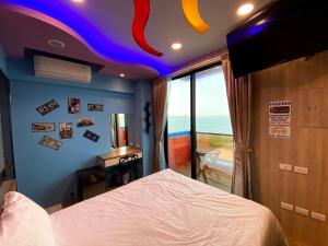 Letto o letti in una camera di 奧斯卡海景民宿Oscar Boutique Seaview Homestay