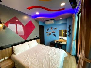 Letto o letti in una camera di 奧斯卡海景民宿Oscar Boutique Seaview Homestay