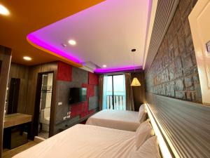 Letto o letti in una camera di 奧斯卡海景民宿Oscar Boutique Seaview Homestay