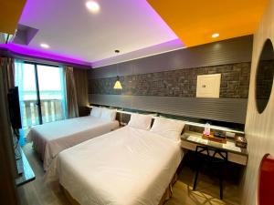 Letto o letti in una camera di 奧斯卡海景民宿Oscar Boutique Seaview Homestay