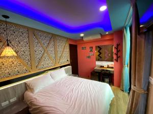 Letto o letti in una camera di 奧斯卡海景民宿Oscar Boutique Seaview Homestay