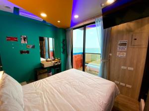Letto o letti in una camera di 奧斯卡海景民宿Oscar Boutique Seaview Homestay