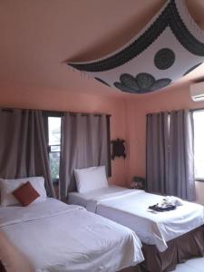 Postel nebo postele na pokoji v ubytování All in 1 Guesthouse