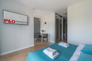Posteľ alebo postele v izbe v ubytovaní Wagonowa P&O Apartments