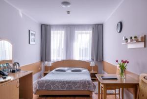 Posteľ alebo postele v izbe v ubytovaní Tailor Hotel Sport & Conference