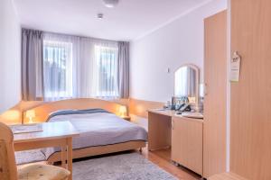 Posteľ alebo postele v izbe v ubytovaní Tailor Hotel Sport & Conference