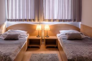 Posteľ alebo postele v izbe v ubytovaní Tailor Hotel Sport & Conference