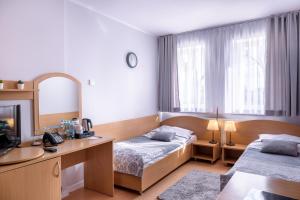 Posteľ alebo postele v izbe v ubytovaní Tailor Hotel Sport & Conference + 37 fotografií