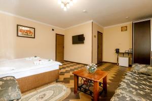 a hotel room with a bed and a table at Hotel A3 in Kislovodsk