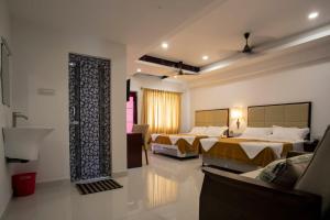 Voodi või voodid majutusasutuse Hotel Viswa Grand toas