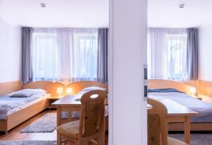 Posteľ alebo postele v izbe v ubytovaní Tailor Hotel Sport & Conference