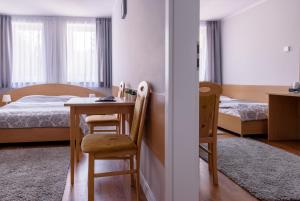 Posteľ alebo postele v izbe v ubytovaní Tailor Hotel Sport & Conference