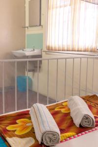 Postel nebo postele na pokoji v ubytování Voyage Guesthouse