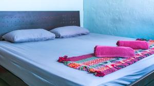Postel nebo postele na pokoji v ubytování Voyage Guesthouse