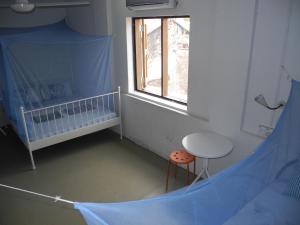 Postel nebo postele na pokoji v ubytování Voyage Guesthouse