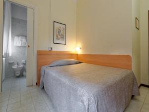 Кровать или кровати в номере Hotel Ravenna