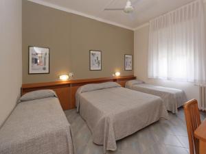 Кровать или кровати в номере Hotel Ravenna
