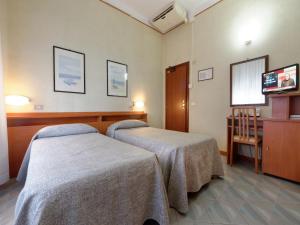 Кровать или кровати в номере Hotel Ravenna