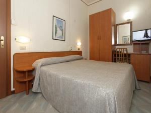 Кровать или кровати в номере Hotel Ravenna