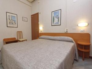 Кровать или кровати в номере Hotel Ravenna
