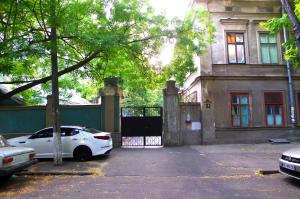a white car parked in front of a house at Успенский in Odesa