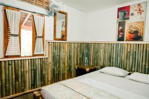 Letto o letti in una camera di Backpacker Kawah Ijen