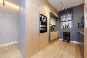 Kuchnia lub aneks kuchenny w obiekcie Apartament nad jeziorem Długim Leśna # 28