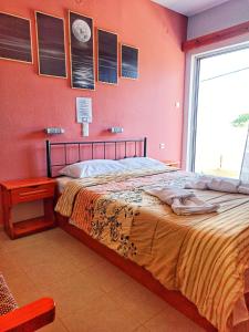 A bed or beds in a room at Panorama Hotel - Restaurant