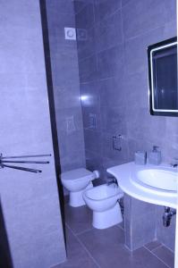 a bathroom with a toilet and a sink at La Fenice in Lampedusa
