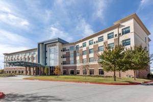 a large office building with a lot of windows at Cambria Hotel Richardson - Dallas in Richardson